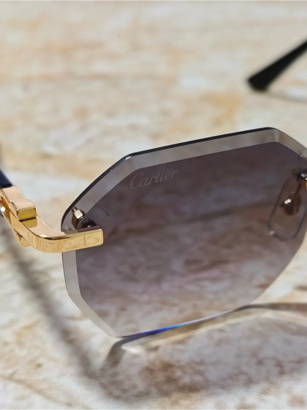 Cartier Women’s Rimless Sunglasses with Purple Gradient Lenses and Gold Accents